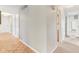 Hallway that branches off into the bathroom and bedrooms, with light parquet flooring at 3125 Anniston Dr, Indianapolis, IN 46227