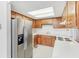 Bright kitchen with white counters, wooden cabinets and stainless steel fridge at 3125 Anniston Dr, Indianapolis, IN 46227