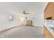 Living room with a decorative fireplace, neutral carpet, white walls, and natural light at 3125 Anniston Dr, Indianapolis, IN 46227