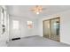 Inviting sunroom featuring a sliding glass door, window, and door with access to the outside at 3125 Anniston Dr, Indianapolis, IN 46227
