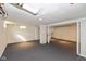Spacious unfinished basement area with painted floor and exposed ceiling at 317 Albany St, Indianapolis, IN 46225
