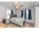 Comfortable bedroom featuring neutral paint, hardwood floors, and lots of natural light at 317 Albany St, Indianapolis, IN 46225