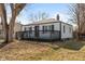 Charming home with a spacious front deck area, mature tree, and classic curb appeal at 317 Albany St, Indianapolis, IN 46225
