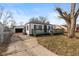 Charming home with a spacious front deck, detached garage, and classic curb appeal at 317 Albany St, Indianapolis, IN 46225