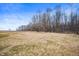 Vast backyard with a beautiful treeline on the horizon, offering a serene and private atmosphere at 3226 E 300 N, Anderson, IN 46012