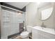 Bright bathroom featuring a walk-in shower with glass doors, a modern vanity, and a round mirror at 3226 E 300 N, Anderson, IN 46012