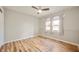 Bright bedroom with a ceiling fan, wood-look flooring, and large windows for natural light at 3226 E 300 N, Anderson, IN 46012