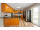 Bright eat-in kitchen with stainless steel appliances, granite countertops, and warm wood cabinetry at 3226 E 300 N, Anderson, IN 46012