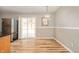 Eat-in kitchen featuring stainless steel appliances, granite countertops, stylish light fixture, and a sliding glass door at 3226 E 300 N, Anderson, IN 46012