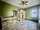 An interior showcases demolition with debris and exposed framework, offering renovation potential with a lot of light at 327 N Bradley Ave, Indianapolis, IN 46201