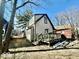 Exterior side view featuring a deck and backyard with potential for landscaping and outdoor enjoyment at 327 N Bradley Ave, Indianapolis, IN 46201