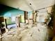 An interior showcases demolition with debris and exposed framework, offering renovation potential and an open layout at 327 N Bradley Ave, Indianapolis, IN 46201