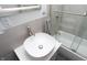 Stylish bathroom featuring a vessel sink, tile surround shower, and modern finishes at 3406 E 20Th St, Indianapolis, IN 46218