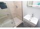 Modern bathroom with walk-in shower featuring black and white tile floor and vanity sink at 3406 E 20Th St, Indianapolis, IN 46218