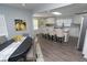Open-concept kitchen and dining room featuring new floors and stylish decor at 3406 E 20Th St, Indianapolis, IN 46218