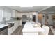 Bright kitchen featuring white cabinets, stainless steel appliances, and stone backsplash at 3406 E 20Th St, Indianapolis, IN 46218