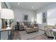 Comfortable living room with gray sofa, patterned arm chair, and side tables at 3406 E 20Th St, Indianapolis, IN 46218