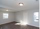 Bright living room with wood flooring, neutral walls, and natural light from two windows at 3406 E 20Th St, Indianapolis, IN 46218