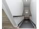 Staircase between first and second floor with black and white painted wood at 3406 E 20Th St, Indianapolis, IN 46218