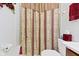 Well-lit bathroom featuring a shower with decorative curtain and modern fixtures at 3520 Inverness Blvd, Carmel, IN 46032