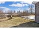 Landscaped backyard with a stream and patio with chairs at 3532 Danbury Ct, Bargersville, IN 46106
