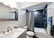 Bathroom featuring a bathtub, a shower with a black tile surround, and a white vanity at 3532 Danbury Ct, Bargersville, IN 46106