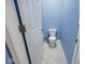 Bright blue powder room with white toilet and marble-look tile floor at 3532 Danbury Ct, Bargersville, IN 46106
