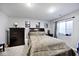 Bedroom with a large bed, a dresser, a window, and three framed photos on the wall at 3532 Danbury Ct, Bargersville, IN 46106