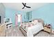 Bright bedroom with a colorful quilt, a ceiling fan, and a vanity at 3532 Danbury Ct, Bargersville, IN 46106