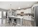 Beautiful open concept kitchen features an island with bar stool seating and stainless steel appliances at 3532 Danbury Ct, Bargersville, IN 46106