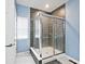 Walk in shower with gray tile and a glass enclosure at 3532 Danbury Ct, Bargersville, IN 46106