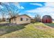 Backyard with a green lawn and an exterior view of the home at 358 Webb Dr, Indianapolis, IN 46227