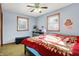 Bright bedroom features two windows, ceiling fan, and grey color scheme at 358 Webb Dr, Indianapolis, IN 46227