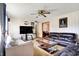 Cozy living room featuring sofas, glass center table, and ceiling fan at 358 Webb Dr, Indianapolis, IN 46227