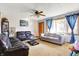 Comfortable living room with neutral carpet, ceiling fan, and ample natural light at 358 Webb Dr, Indianapolis, IN 46227