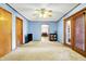 Living room with a ceiling fan, a door, and access to other rooms at 358 Webb Dr, Indianapolis, IN 46227