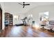 Large room featuring exercise equipment with wood floors and bright windows at 358 Webb Dr, Indianapolis, IN 46227