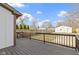 Spacious back deck overlooking fenced yard with garage and green spaces at 360 S Spencer Ave, Indianapolis, IN 46219