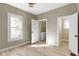 The bedroom features new flooring and paint and access to a nearby laundry room at 360 S Spencer Ave, Indianapolis, IN 46219