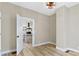 Bright dining room with modern light fixture opens to a kitchen with stone-accented island at 360 S Spencer Ave, Indianapolis, IN 46219