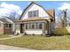 Charming two-story home featuring unique architectural details and a well-manicured front yard at 360 S Spencer Ave, Indianapolis, IN 46219