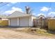 Two-car garage with white siding and gray doors complements the home's exterior aesthetic at 360 S Spencer Ave, Indianapolis, IN 46219