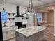 The kitchen features updated appliances, lighting, and a cozy window seat area at 360 S Spencer Ave, Indianapolis, IN 46219