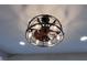 Modern ceiling fan light fixture with metal accents, blending industrial style with functional design at 360 S Spencer Ave, Indianapolis, IN 46219