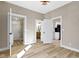 Living area showcases new flooring, fresh paint, and access to a full bath and kitchen at 360 S Spencer Ave, Indianapolis, IN 46219