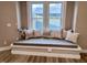 Comfortable window seat nook with accent pillows provides additional seating and natural light at 360 S Spencer Ave, Indianapolis, IN 46219