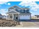 New construction two-story home with a two-car garage and stone accents, situated on a sunny day at 3667 Thomas Jefferson St, Westfield, IN 46074