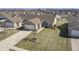 An elevated shot of a home with a driveway, front yard and neighborhood overview at 3677 Cedar Cove Ct, New Palestine, IN 46163