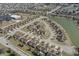 Expansive aerial view of a residential community with well-maintained homes and a scenic lake at 3677 Cedar Cove Ct, New Palestine, IN 46163