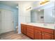 Bathroom with double sink vanity, a toilet and a door leading to the tub at 3677 Cedar Cove Ct, New Palestine, IN 46163